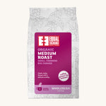 Equal Exchange organic and fairtrade medium roast coffee beans in a white bag.