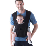 Man wearing a blue top and his baby on his front facing outwards in the Ergobaby Embrace Soft Knit Newborn Baby Carrier in Pure Black. Front view white background.