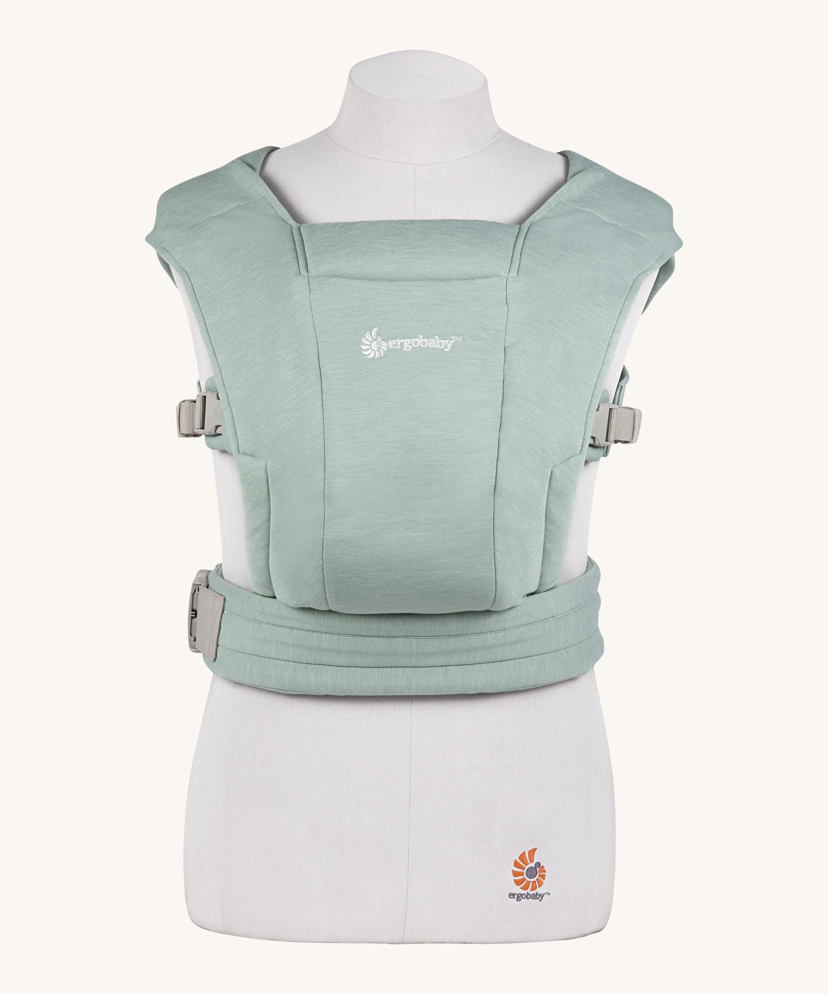 Ergobaby Embrace Soft Knit Newborn Baby Carrier in Jade. Front view on a mannequin.