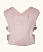 Ergobaby Embrace soft knit newborn baby carrier in blush pink. Front on view.