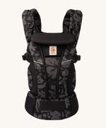 Ergobaby Omni Breeze Baby Carrier in omni breeze. A black coloured carrier with an abstract floral pattern. 