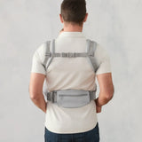 Ergobaby omni deluxe baby carrier  SoftTouch cotton in pearl grey. Back of the carrier on a parent.