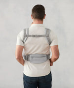 Ergobaby omni deluxe baby carrier  SoftTouch cotton in pearl grey. Back of the carrier on a parent.