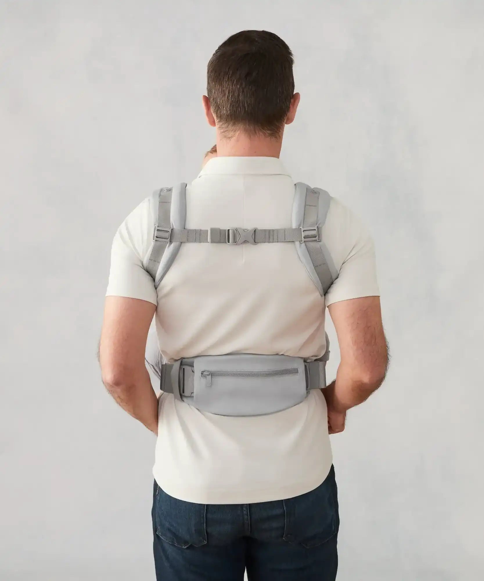 Ergobaby omni deluxe baby carrier  SoftTouch cotton in pearl grey. Back of the carrier on a parent.