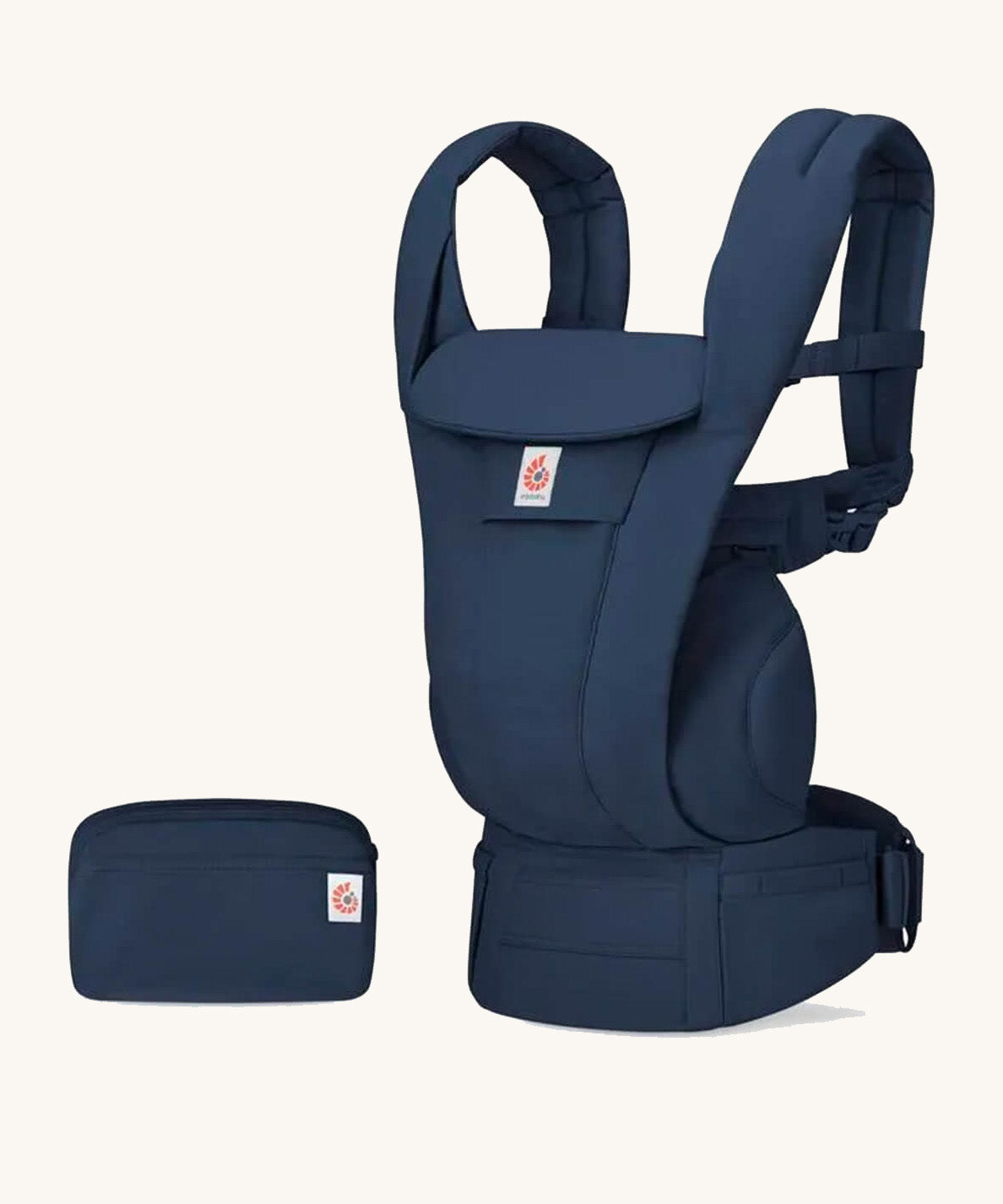 The Ergobaby Omni Deluxe Cotton baby carrier in Midnight Blue, with a handy storage purse that can attach to the carrier.