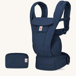The Ergobaby Omni Deluxe Cotton baby carrier in Midnight Blue, with a handy storage purse that can attach to the carrier.