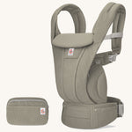 The Ergobaby Omni Deluxe Mesh baby carrier in Soft Olive, with a handy detachable storage bag.