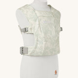 The Ergobaby Soft & Snug knit baby carrier in a sage meadows pattern.