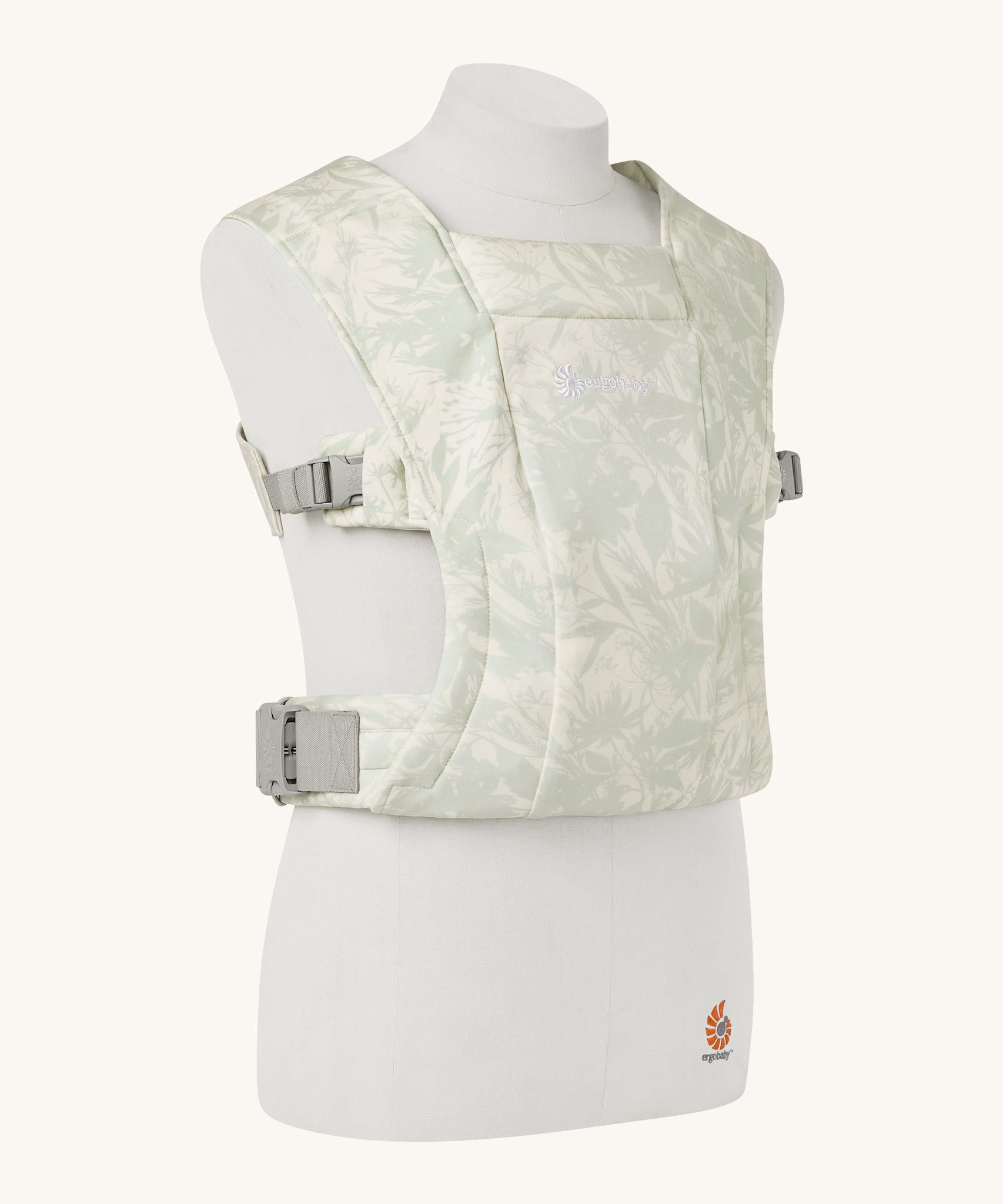 The Ergobaby Soft & Snug knit baby carrier in a sage meadows pattern.