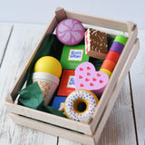 Erzi assorted candies wooden play food set. Wooden toy play food in a small wooden crate.