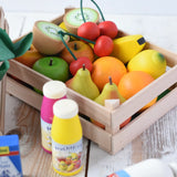 Erzi big wooden toy crate for fruit filled with wooden fruit play food including cherries, kiwis, bananas, apples, lemons and oranges.