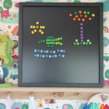 A crocodile, sun and tree on a Grimm's magnetic board made from Erzi pixelino magnetic blocks 