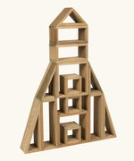 Erzi outdoor building blocks stacked up into a rocket shape.