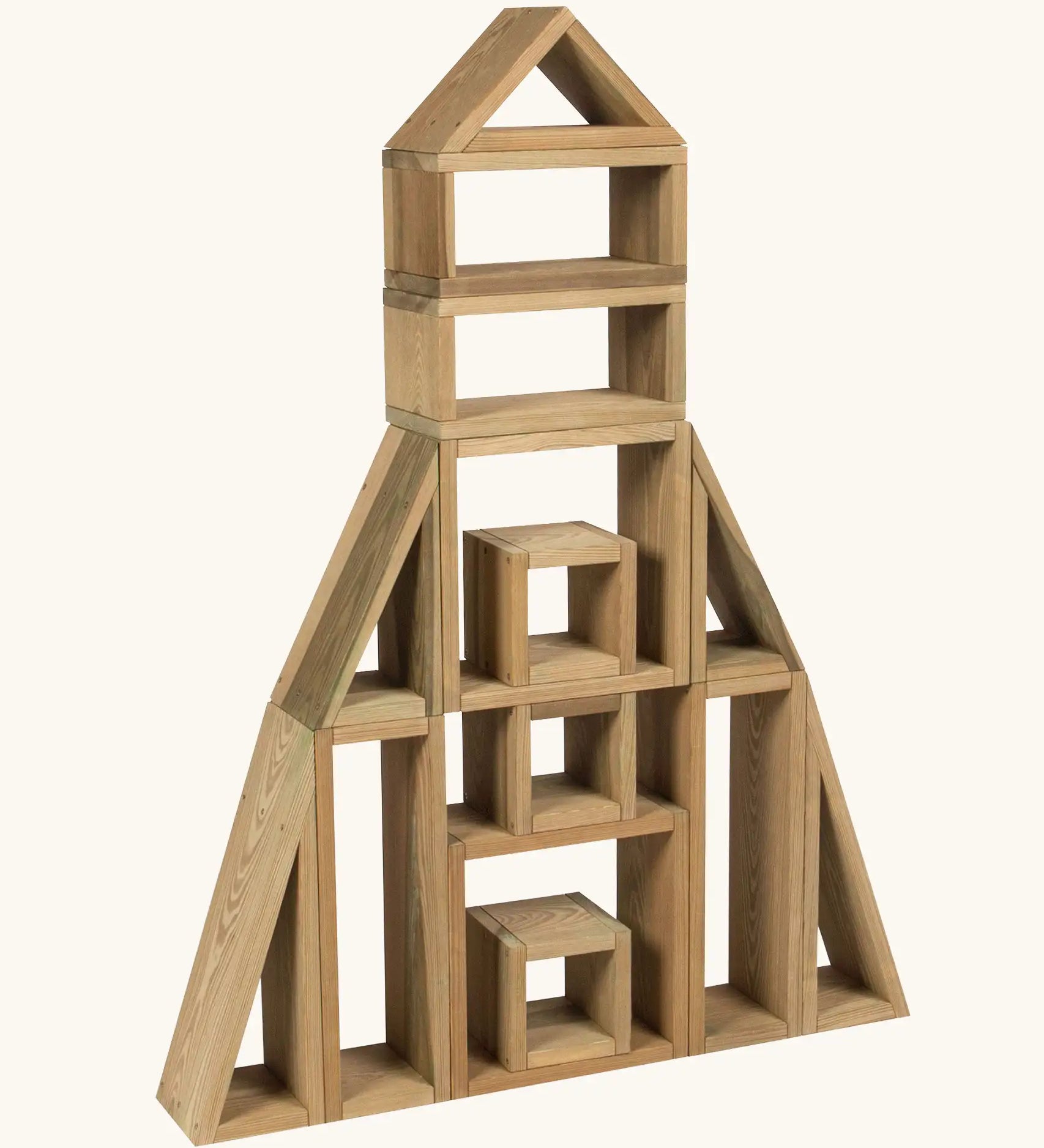 Erzi outdoor building blocks stacked up into a rocket shape.