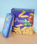 Erzi play food penne pasta  metal tin with the lid taken off in the Babipur playroom.