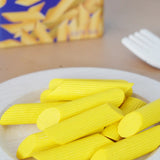 Erzi wooden play food penne pasta placed on a plate in the Babipur playroom.