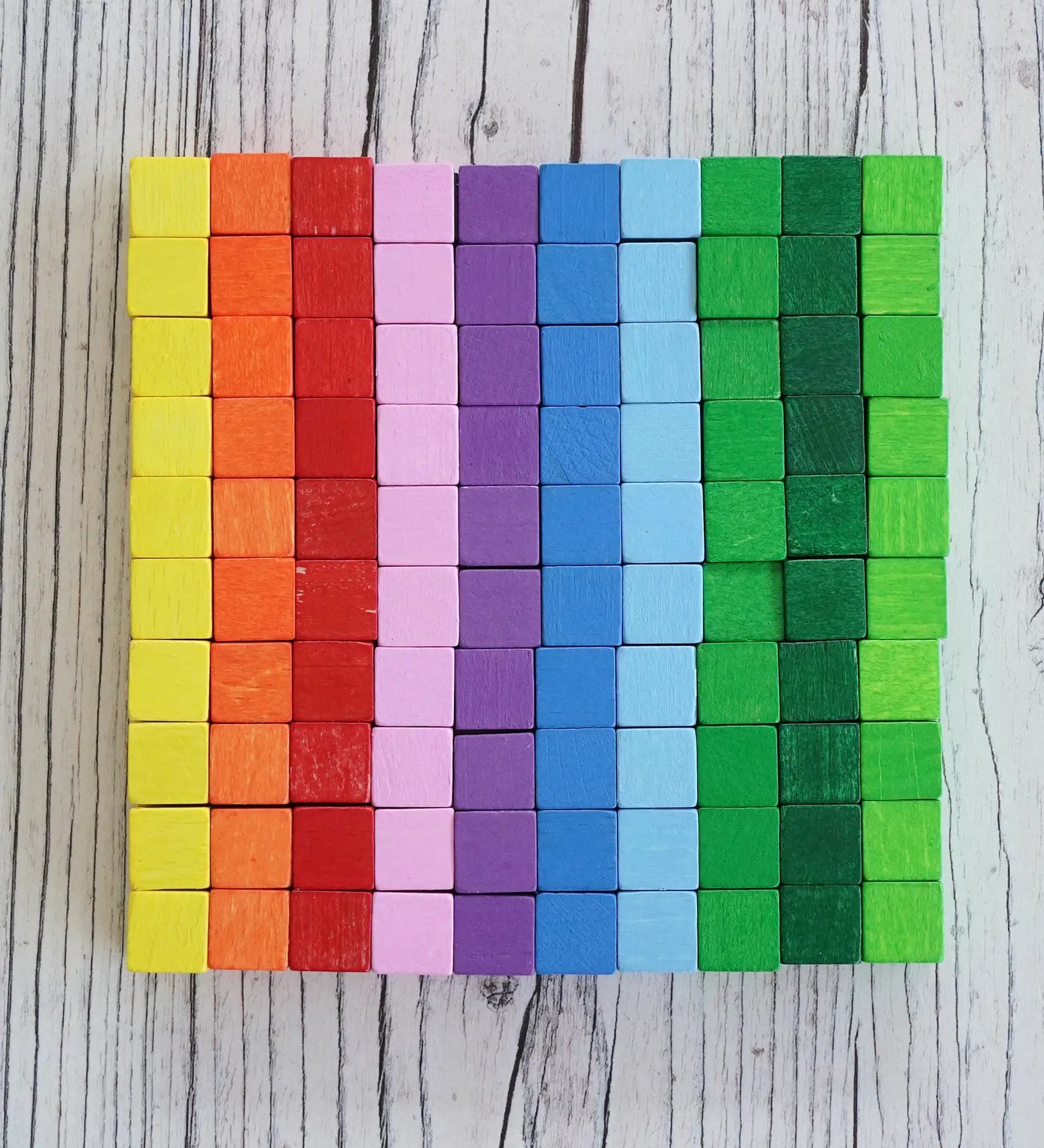 Eri Pixelino magnetic block set showing small multicolored wooden cube blocks in uniform