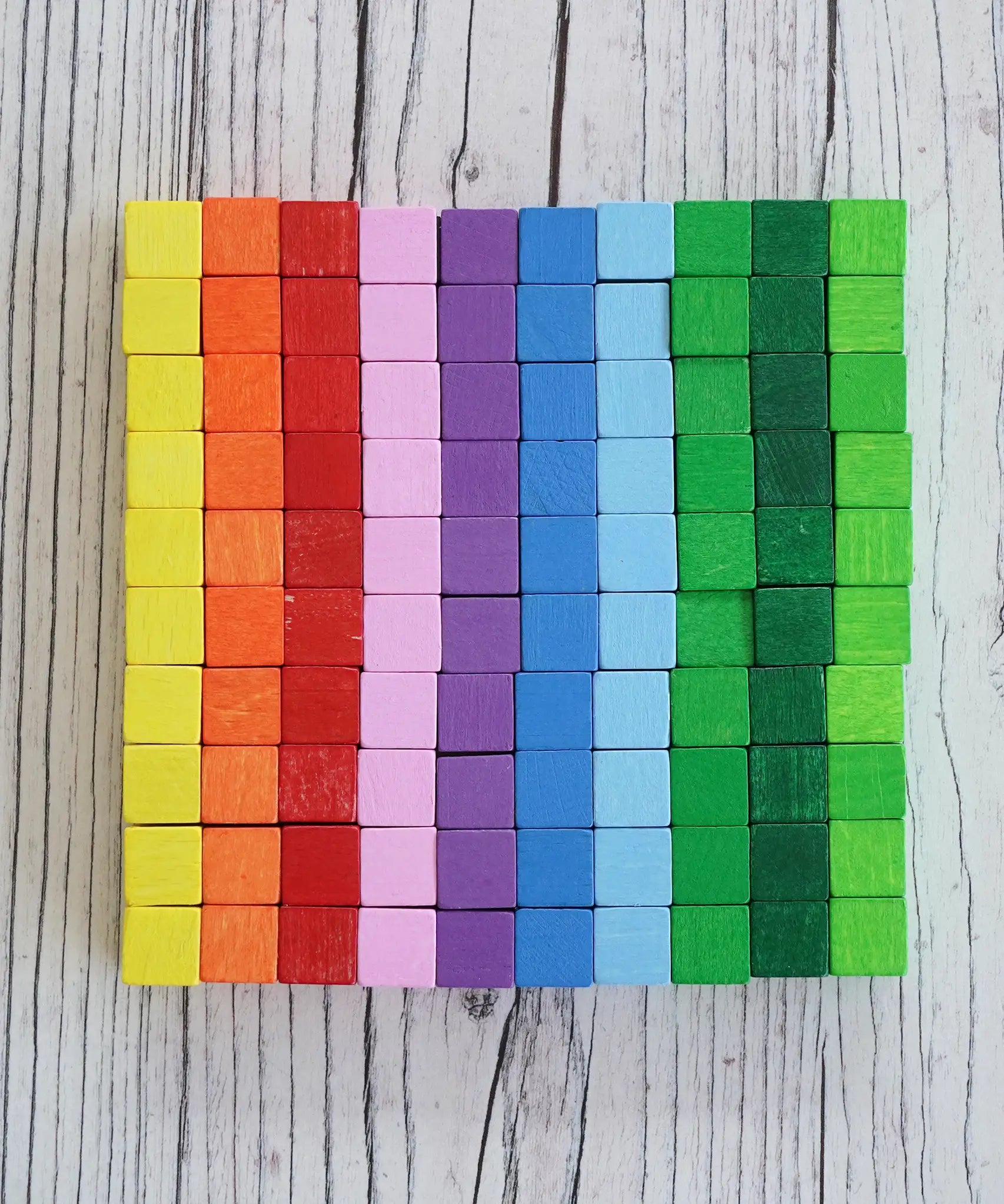 Eri Pixelino magnetic block set showing small multicolored wooden cube blocks in uniform