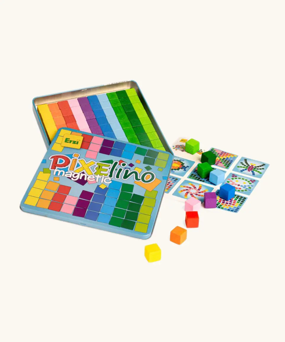 Eri Pixelinó magnetic toy set in a colorful metal tin, shown open with rainbow grid tiles, game cards, and small multicolored cube blocks.