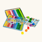 Eri Pixelinó magnetic toy set in a colorful metal tin, shown open with rainbow grid tiles, game cards, and small multicolored cube blocks.