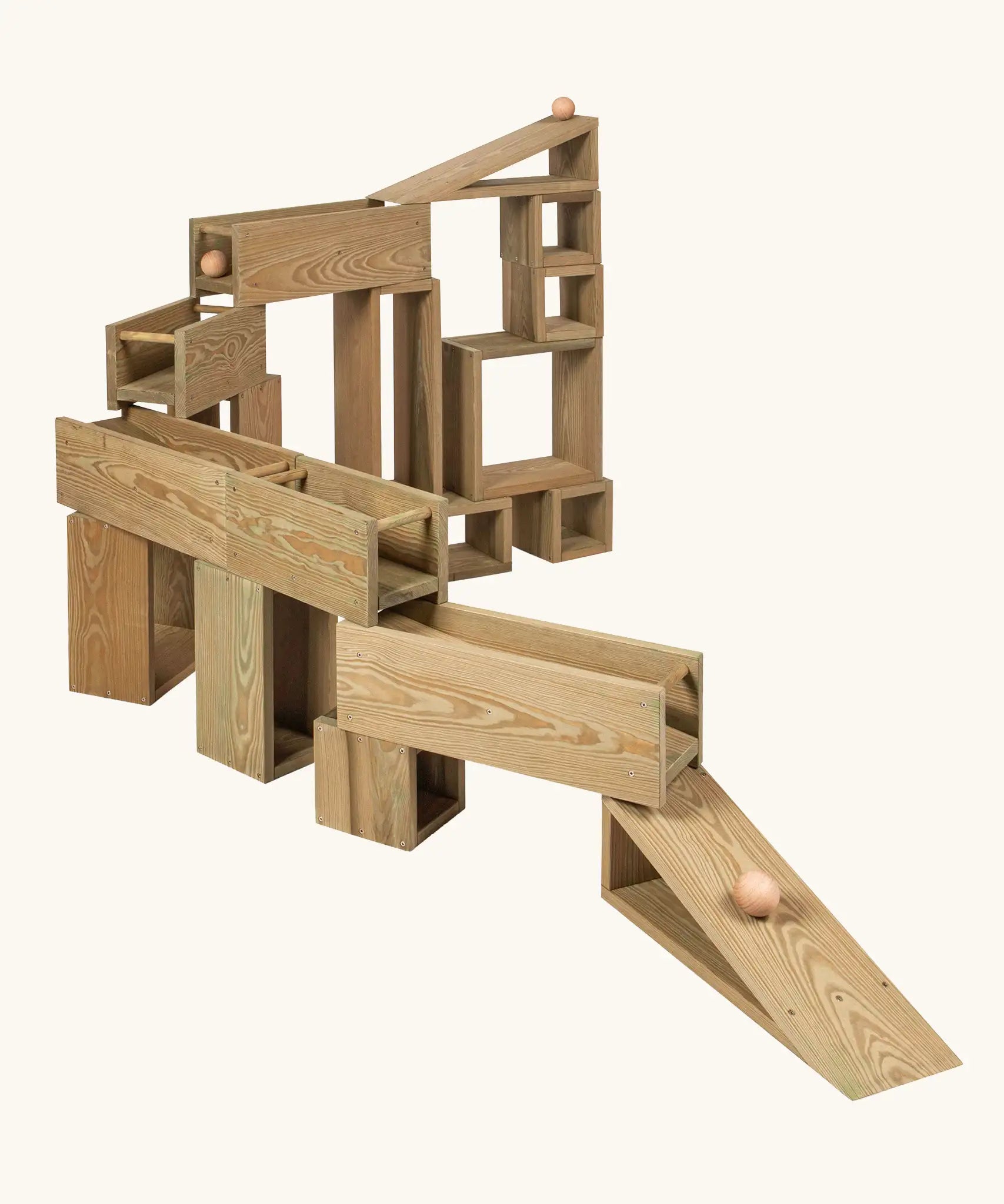 Erzi Outdoor Building Blocks with 24 wooden pieces stacked to form a ball run.
