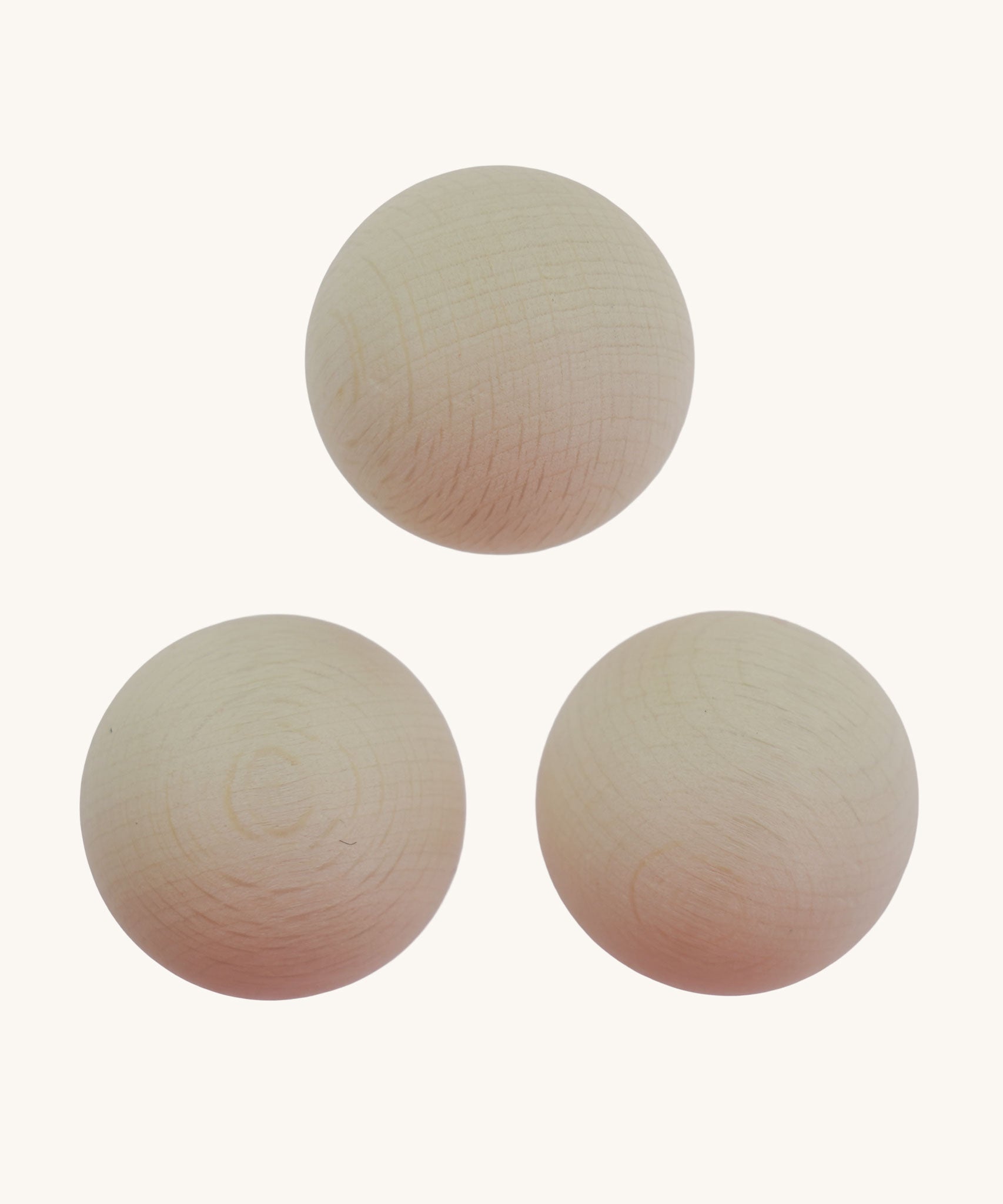 The set of three Erzi 30mm marbles. These white coloured marbles can be   used on an Erzi trackboard, on a ball run or for any other open-ended play.