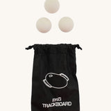 The Erzi White Wooden Marbles 30mm Beech Set  shown next to a small black drawstring storage bag that they come with. 