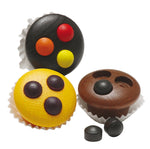 Three Erzi Muffins Wooden Play Food items in paper cases with removeable toppings. Plain background.