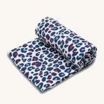 Etta Loves Extra Large Organic Cotton Baby Muslin Square - Blue Leopard on a cream background