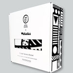 The Etta Loves x Camille Walala Muslin Blanket shown in it's box. 