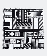 The Etta Loves x Camille Walala XL Muslin Square - Mono folded up into a square on a plain background. 