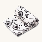 Etta Loves Extra Large Organic Cotton Baby Muslin Square - Dandelion, on a cream background