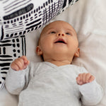 A closer look at the faces print from the Etta Loves Organic Cotton Baby Muslin Squares 3 Pack - Drawing Print
