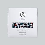 The Etta Loves organic cotton sensory muslin square in its stylish white cardboard packaging. 