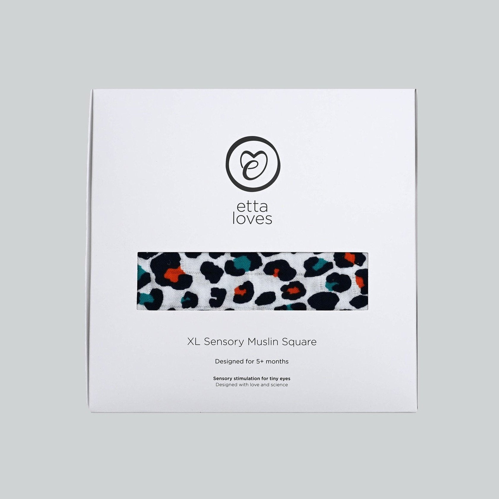The Etta Loves organic cotton sensory muslin square in its stylish white cardboard packaging. 