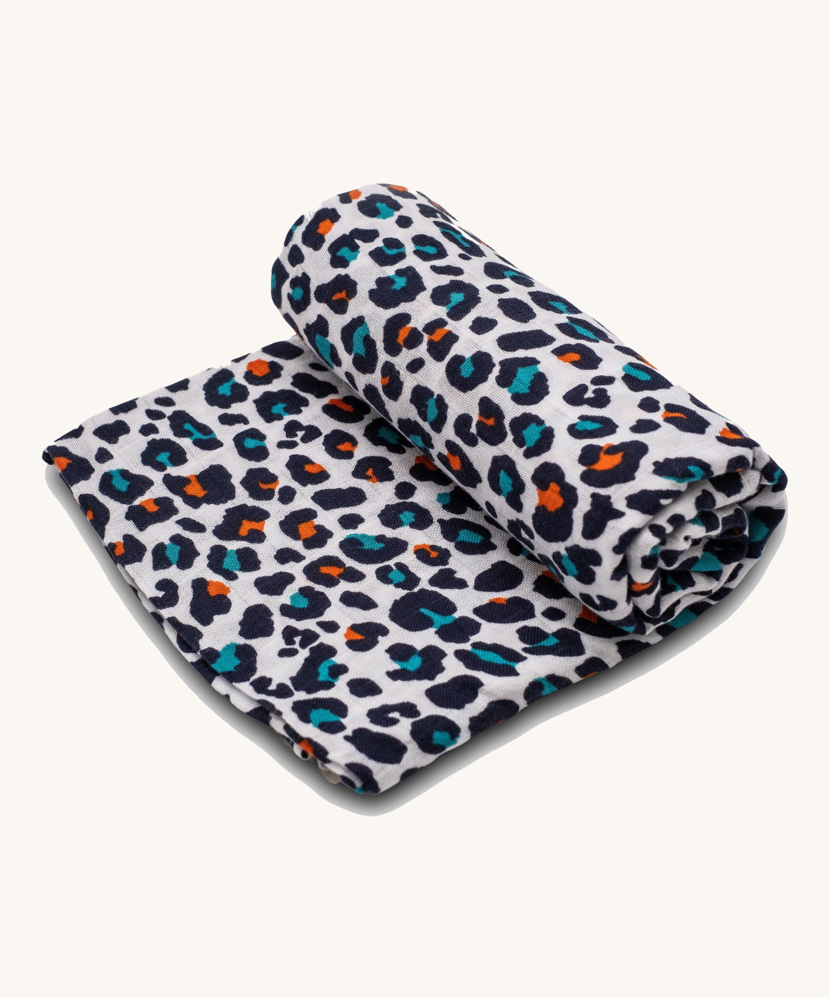 The Etta Loves extra large organic cotton sensory muslin square, in an Orange Leopard print.