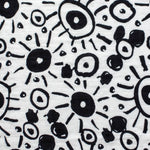 The Etta Loves Extra Large Organic Cotton Baby Muslin Squares tied to a wooden bamboo ladder in black leopard spots