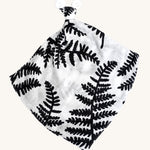 Etta Loves Organic Cotton Baby Comforter - Fern. A bold black and white fern leaf print, with a knotted top and soft ears