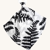 Etta Loves Organic Cotton Baby Comforter - Fern. A bold black and white fern leaf print, with a knotted top and soft ears