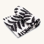 Etta Loves Extra Large Organic Cotton Baby Muslin Square - Fern, made from GOTS organic cotton with a black leafy fern print. On a cream background