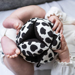 A closer look at the Etta Loves Organic Sensory Grasping Ball with black and white spots