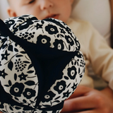 Etta Loves x Liberty organic cotton sensory grasping ball showing the Liberty pattern and black inner