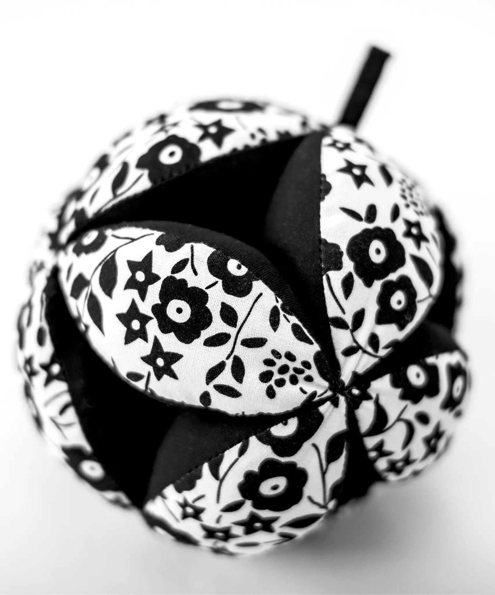 Etta Loves x Liberty organic cotton sensory grasping ball showing Liberty print detail and black inner