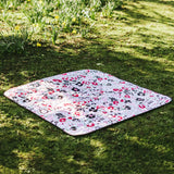 Etta Loves x Liberty organic cotton colourful playmat laid on grass