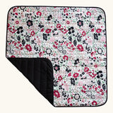 Etta Loves x Liberty organic cotton colourful sensory outdoor playmat showing a repeating floral design and a black reverse panel