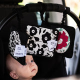 Set of 3 Etta Loves x Liberty sensory hanging squares hanging on a buggy with a baby inside