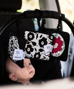 Set of 3 Etta Loves x Liberty sensory hanging squares hanging on a buggy with a baby inside