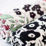 Etta Loves x Liberty muslin squares - 2 Pack showing a close up of the monochrome and pastel floral design  on each cloth