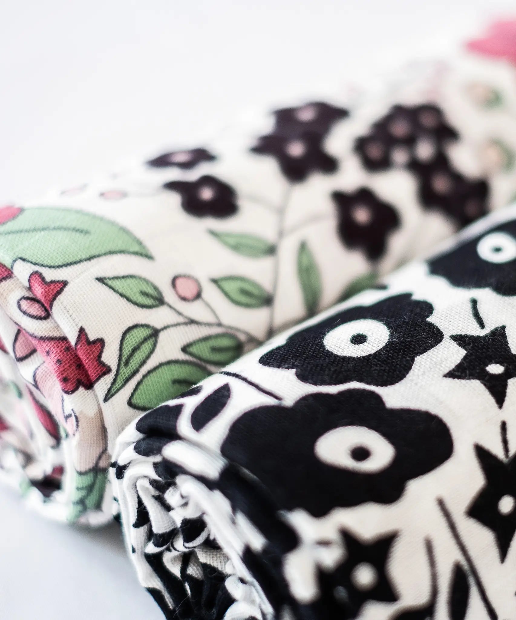 Etta Loves x Liberty muslin squares - 2 Pack showing a close up of the monochrome and pastel floral design  on each cloth