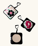 Set of 3 Etta Loves x Liberty hanging squares showing 2 pastel floral designs and a sensory mirror 